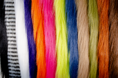 Fly Fur Spectrum (from left to right): Black, White Barred Black, White, Dark Purple, Hot Orange, Hot Pink, Chartreuse, Dark Sapphire Blue, Tan, Olive, Rust, and Brown.